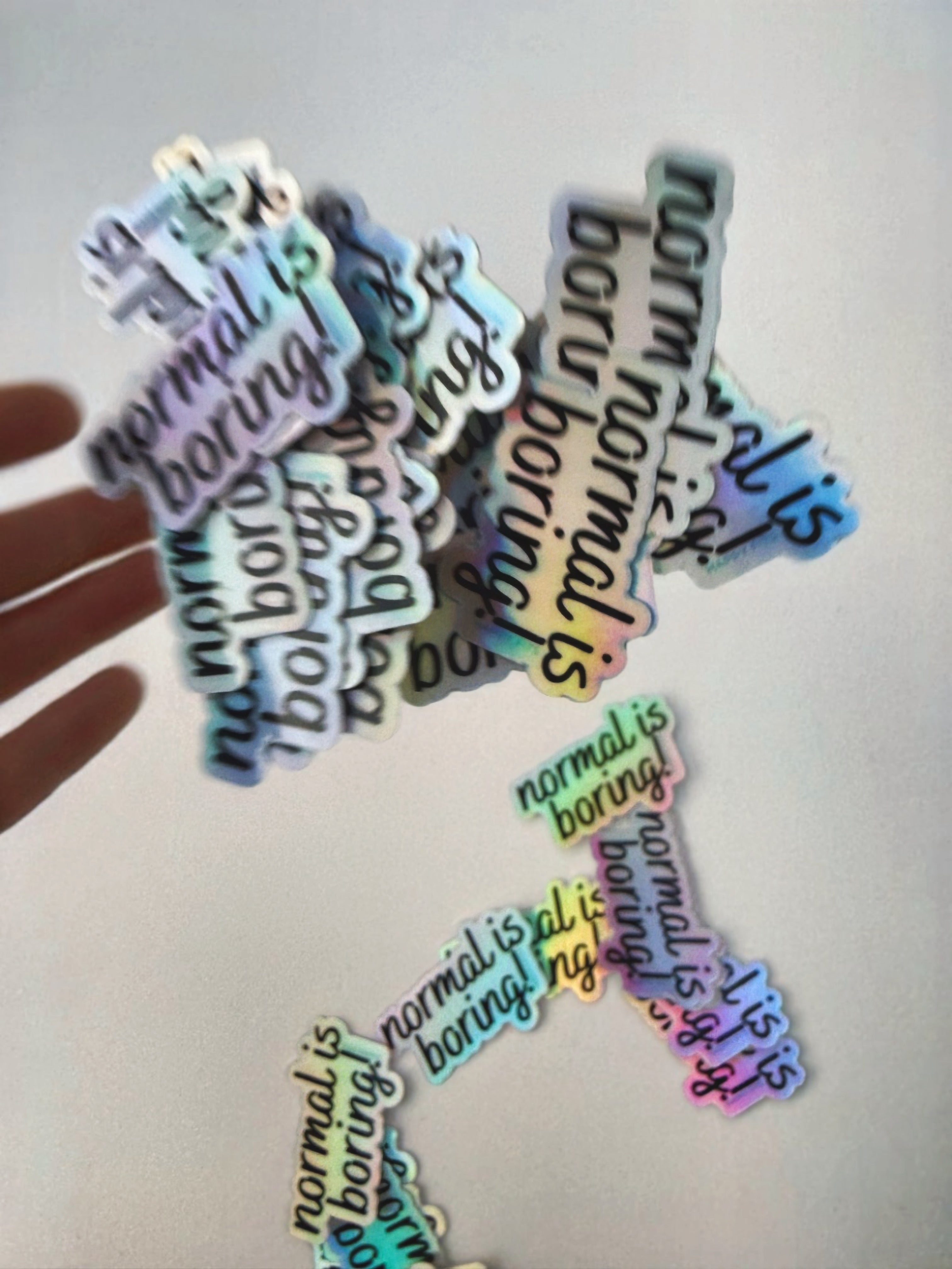 normal is boring! holographic sticker